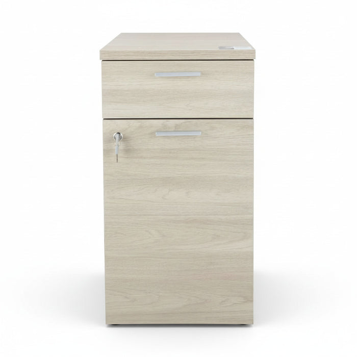 Desk height pedestal in light wood finish with two drawers and metal bar pulls