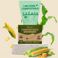 A box of Airmex compost bags sits on a light gray pedestal with a large mint-green compost bag floating behind it. The scene includes corn cobs, green leaves, and loose corn kernels on a warm beige background.
