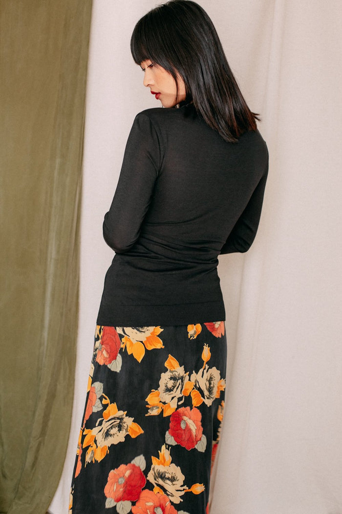 Shop drape knit top black by Cossac at thegreenlabels