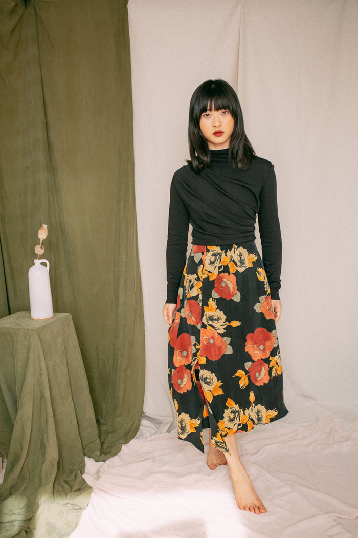 Shop drape knit top black by Cossac at thegreenlabels