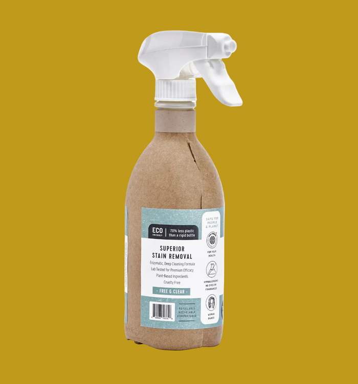 Spray bottle with cardboard container and white label on a white background