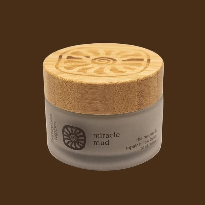 Jar of 'miracle mud' with a wooden lid on a white background