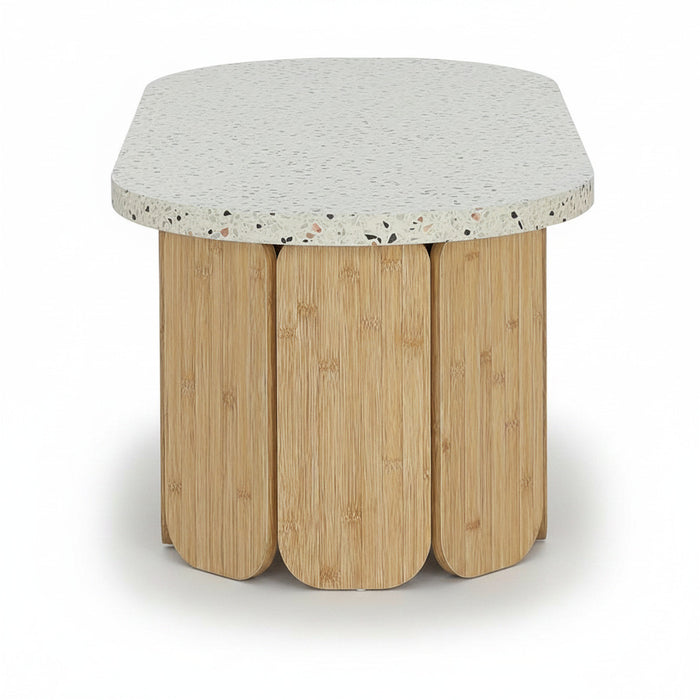 Center table with speckled round top and four light wood scalloped legs