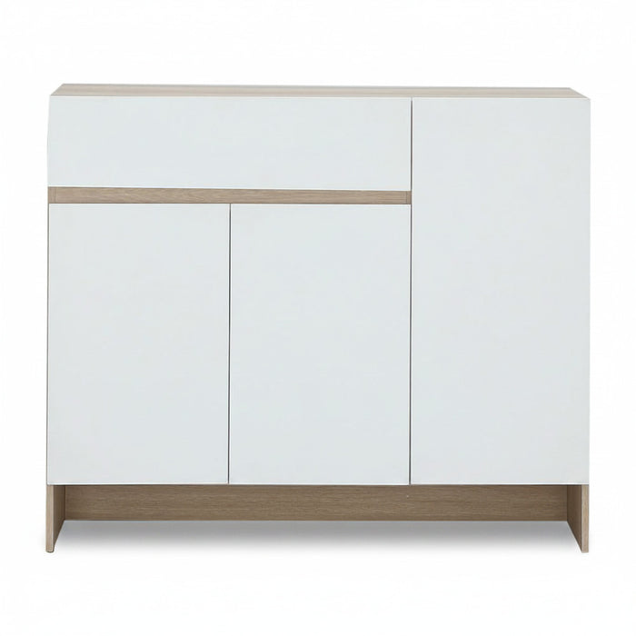Shoe cabinet with white doors, light wood top rail and base, three-panel front.