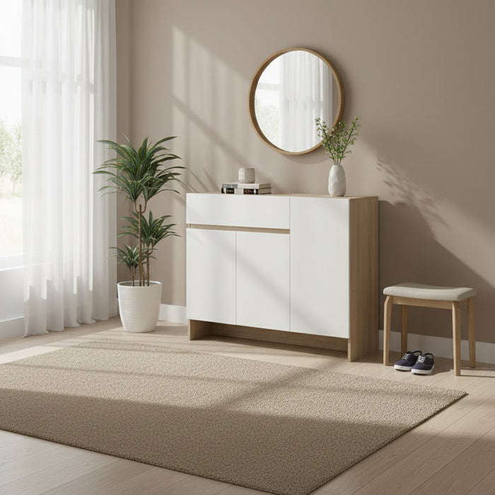 Shoe cabinet with white doors and light wood trim, standing on the floor.