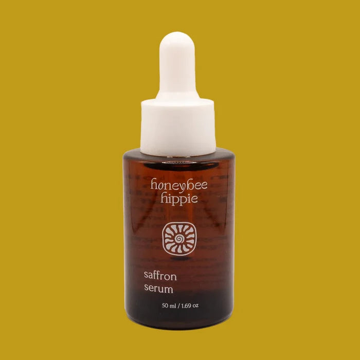 Honeybee Hippie saffron serum bottle on a beige background